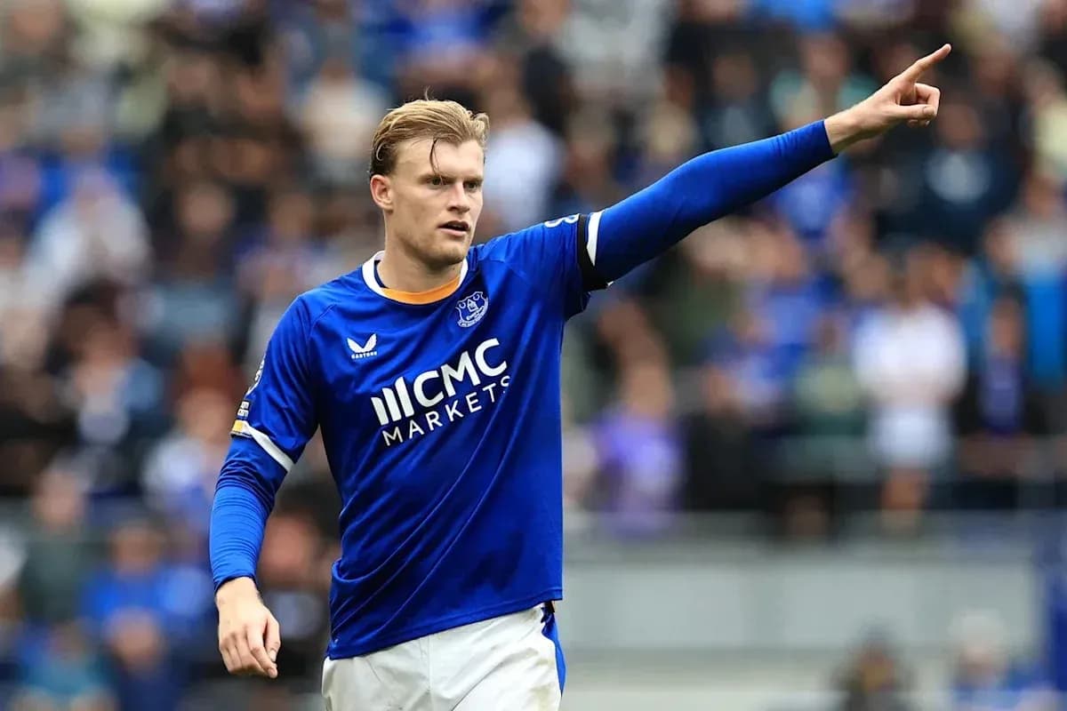 Player in blue jersey gesturing during a match Player in blue jersey gesturing during a match