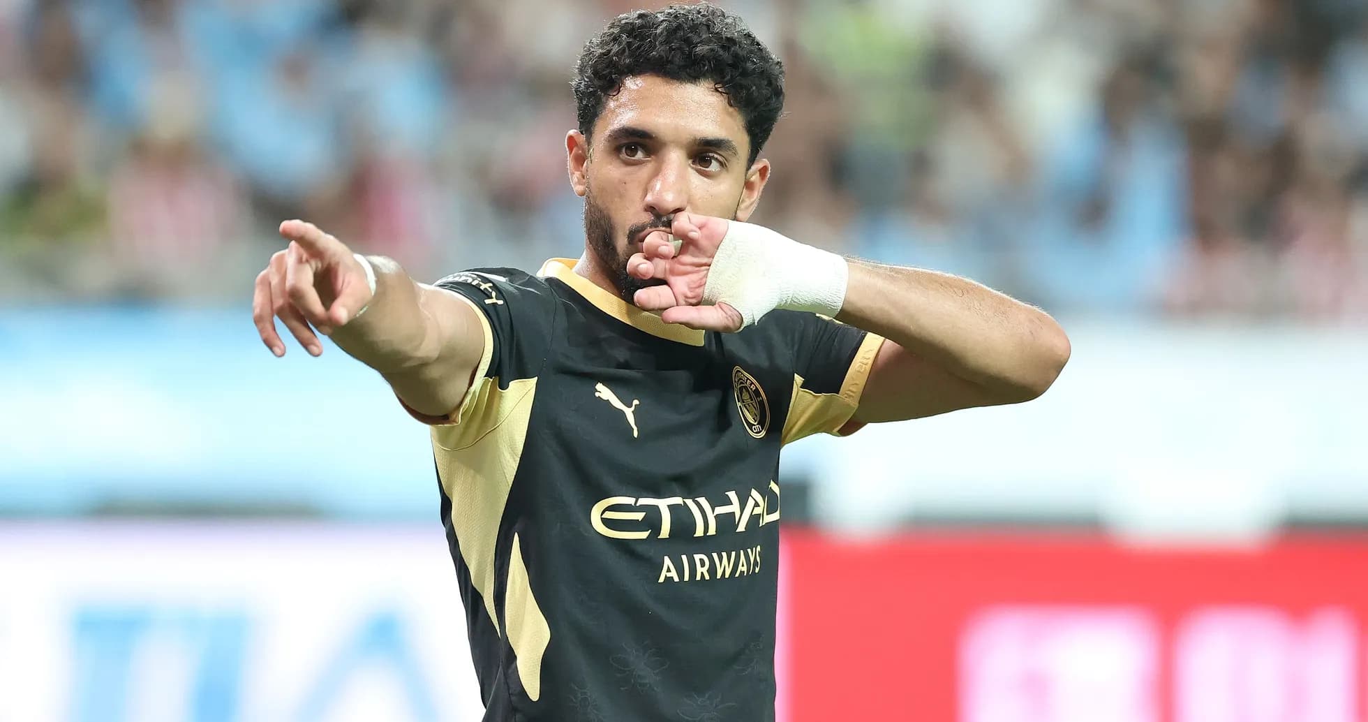 Player celebrating and pointing during a match Player celebrating and pointing during a match