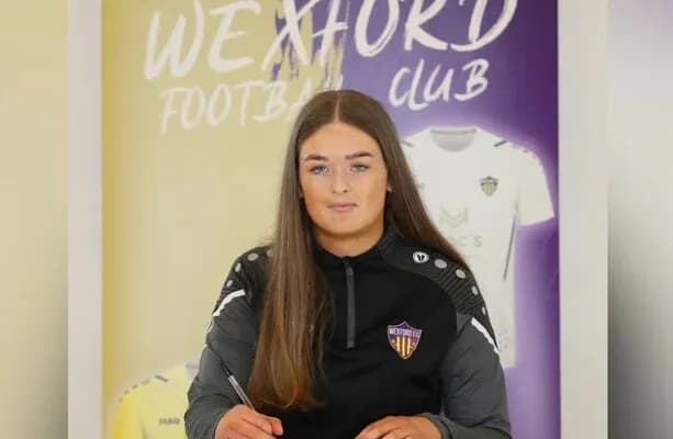 Player signing contract for Wexford Football Club Player signing contract for Wexford Football Club