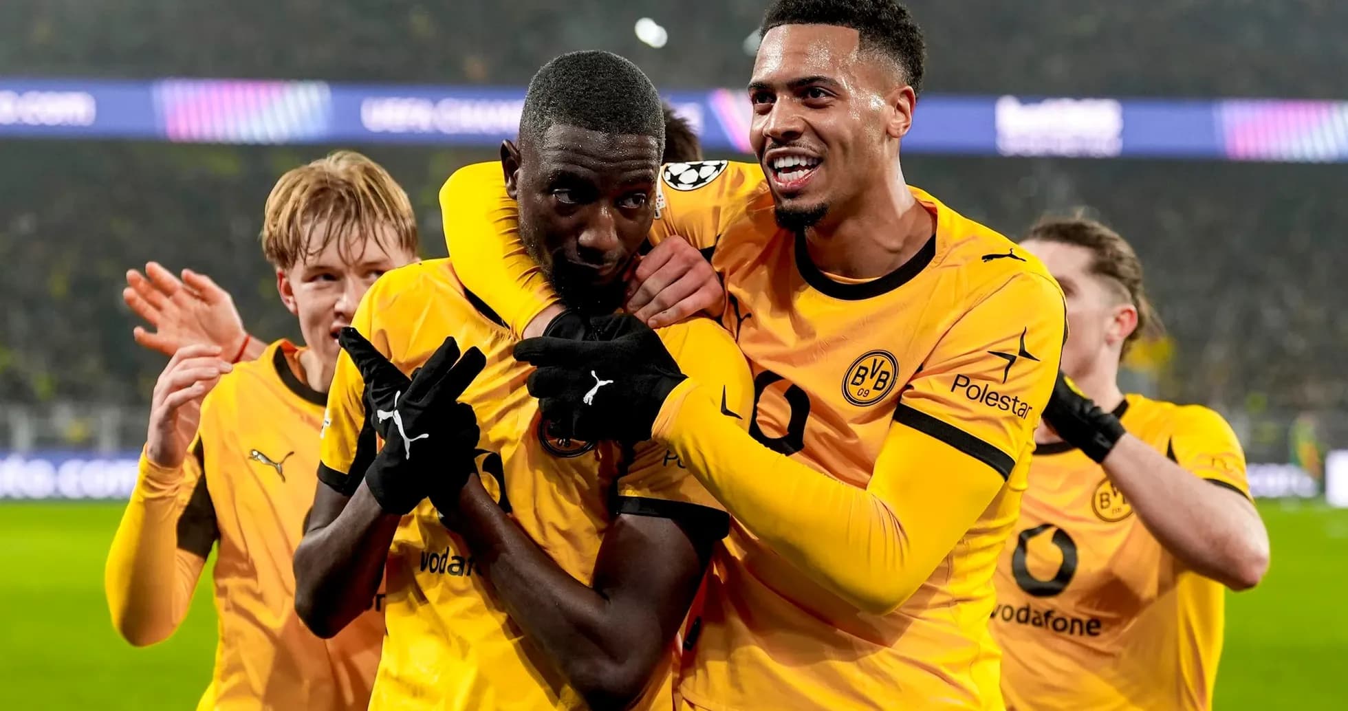 Borussia Dortmund players celebrating a goal Borussia Dortmund players celebrating a goal