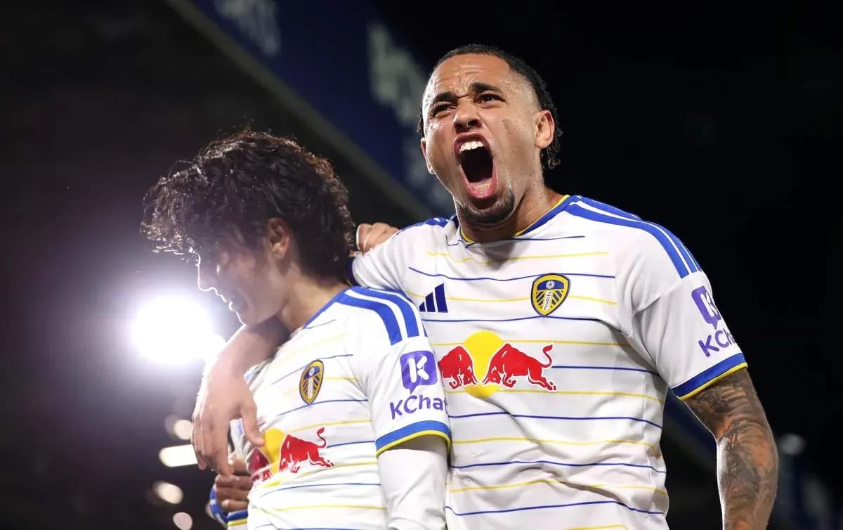 Two Leeds United players celebrating a goal Two Leeds United players celebrating a goal