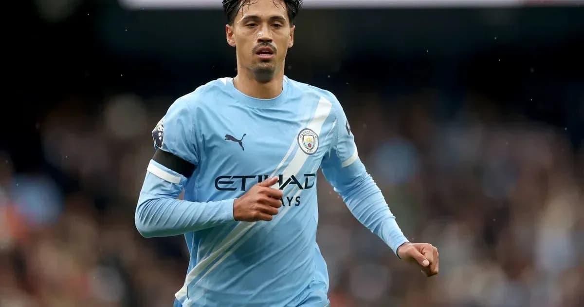 Player running in Manchester City jersey during match Player running in Manchester City jersey during match