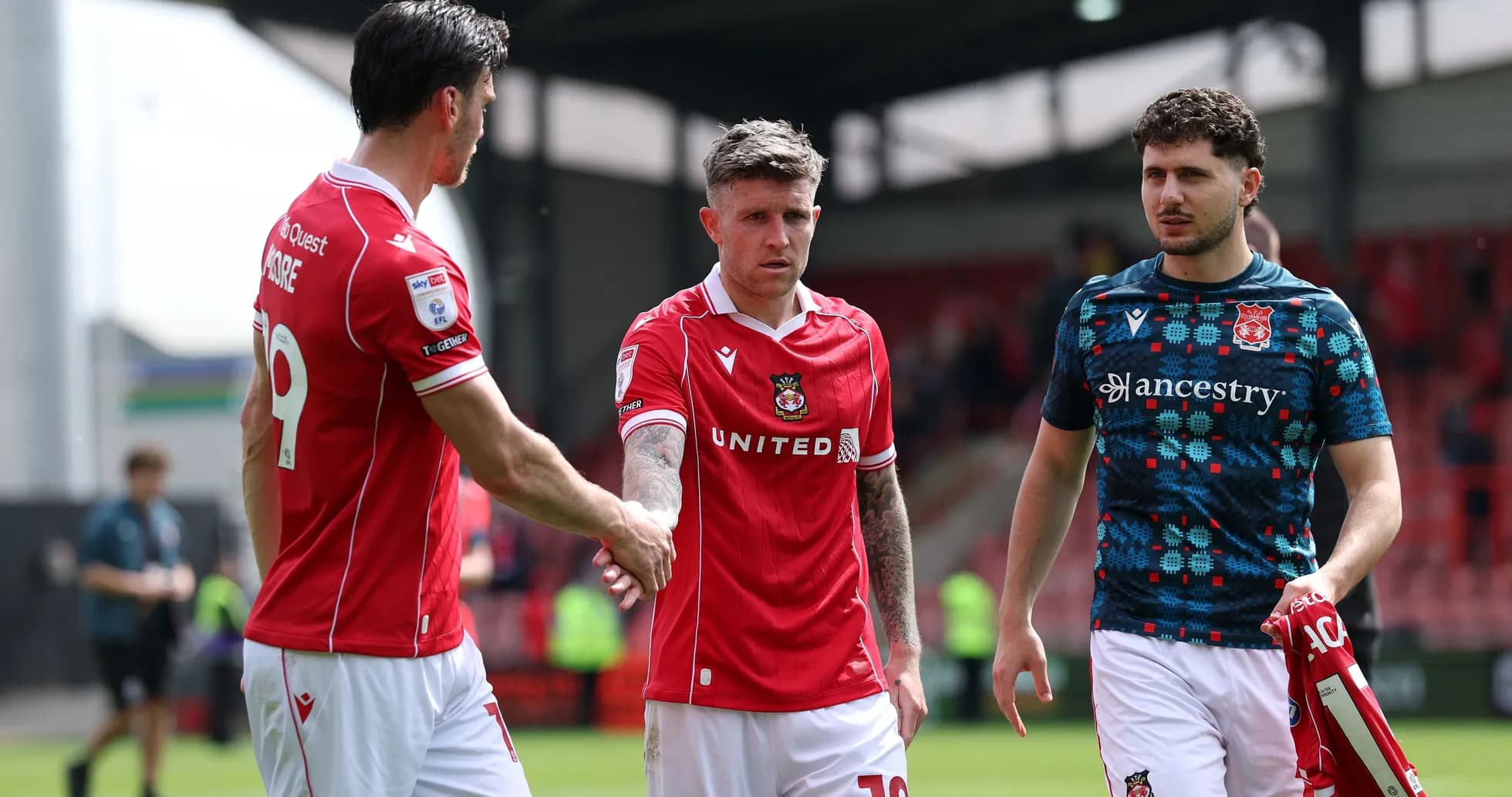 Wrexham players shaking hands after a match Wrexham players shaking hands after a match