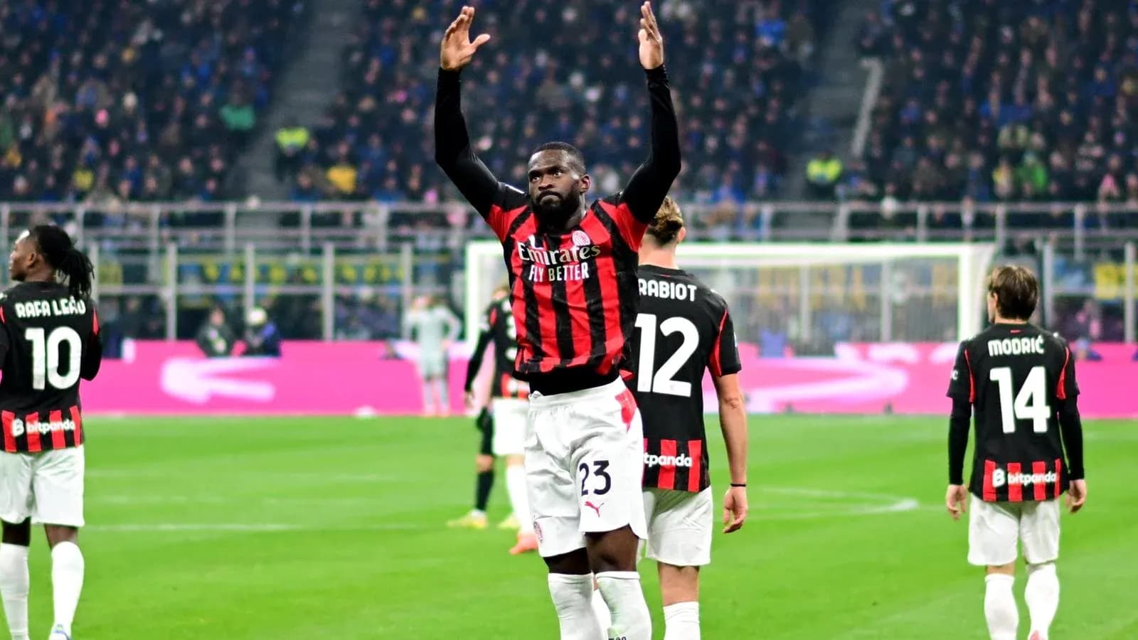 AC Milan players celebrating on the pitch AC Milan players celebrating on the pitch