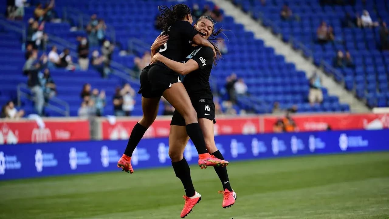 Players celebrating during NWSL match Players celebrating during NWSL match