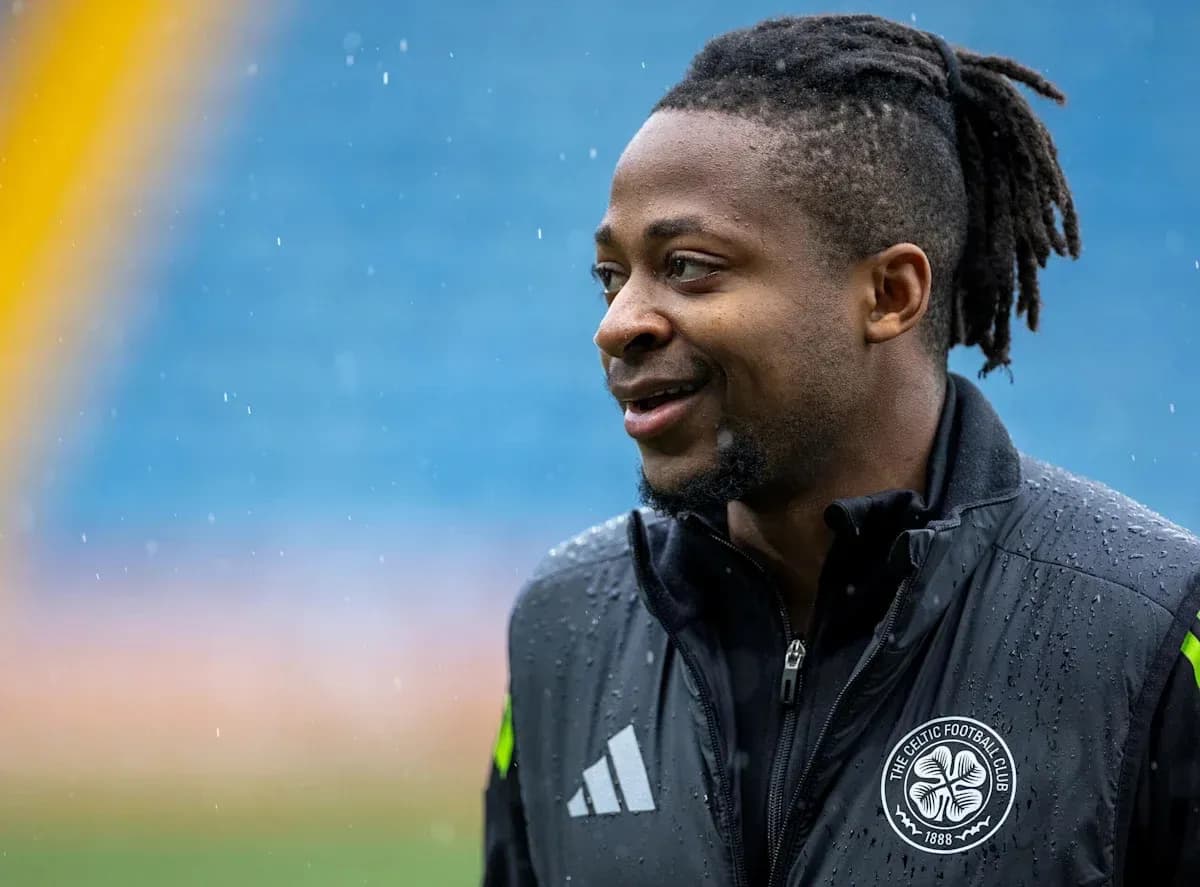 Player in Celtic FC jacket during rainy day Player in Celtic FC jacket during rainy day