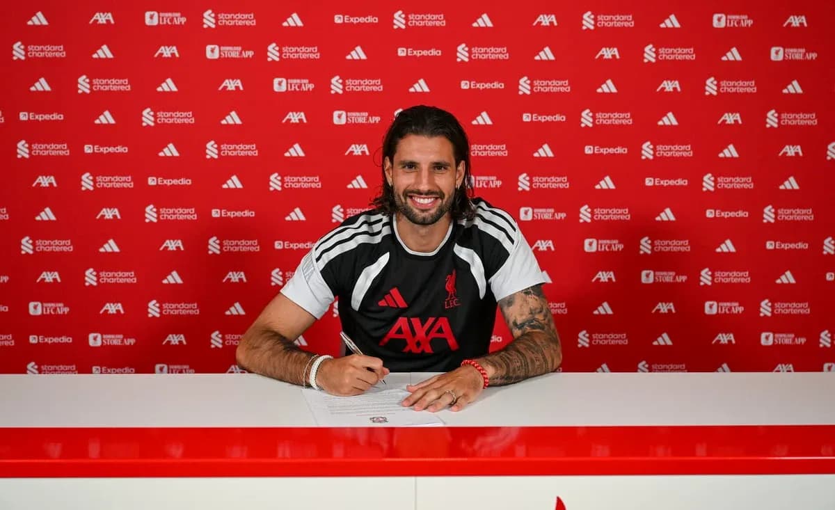 Player signing contract at Liverpool FC press event Player signing contract at Liverpool FC press event