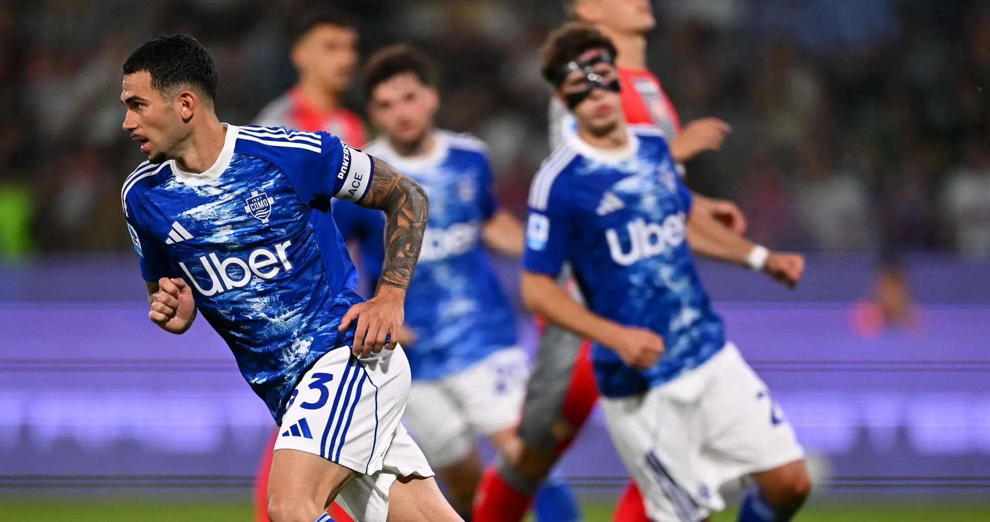Como player running during Serie A match Como player running during Serie A match