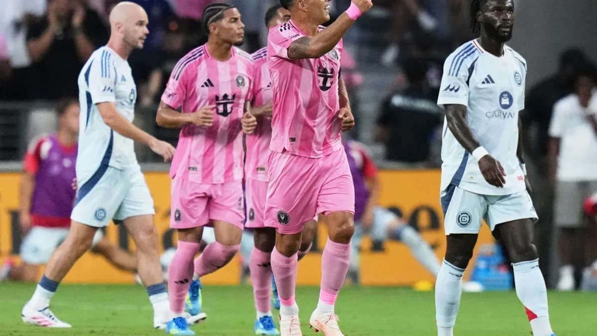 Players celebrating during a soccer match Players celebrating during a soccer match