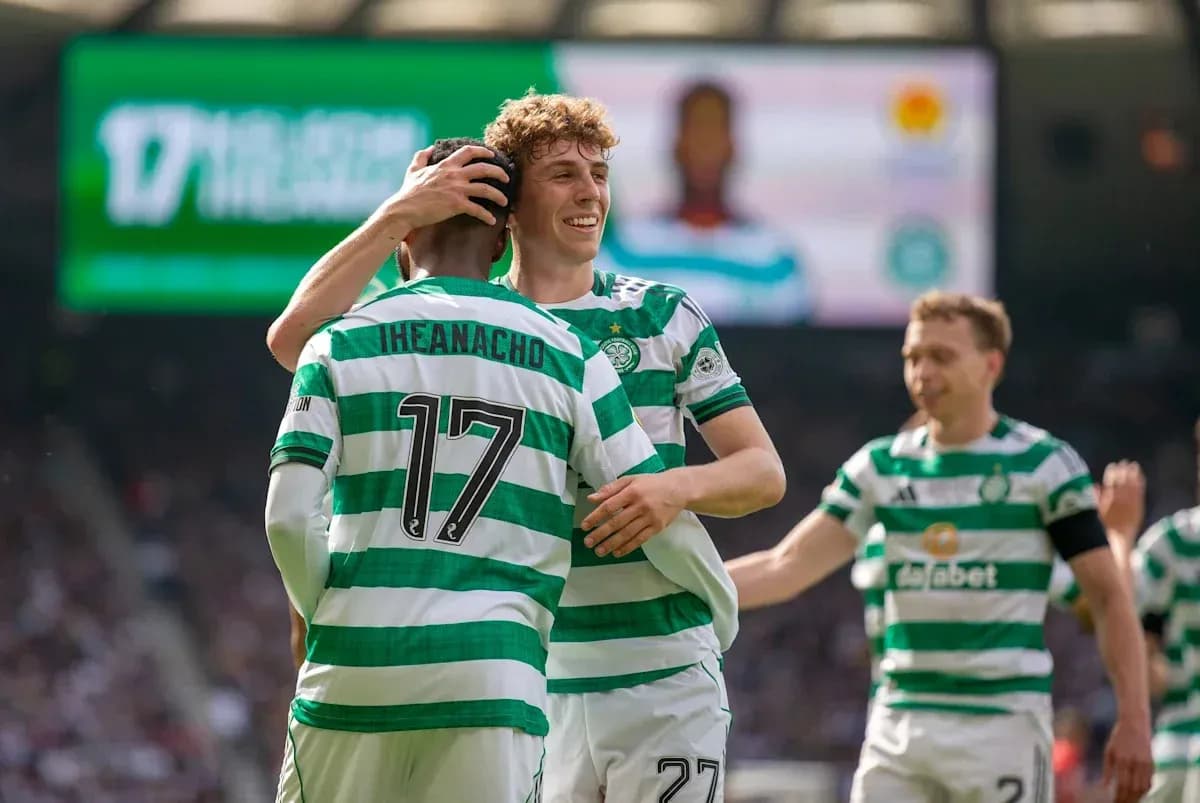 Celtic players celebrating a goal on the pitch Celtic players celebrating a goal on the pitch