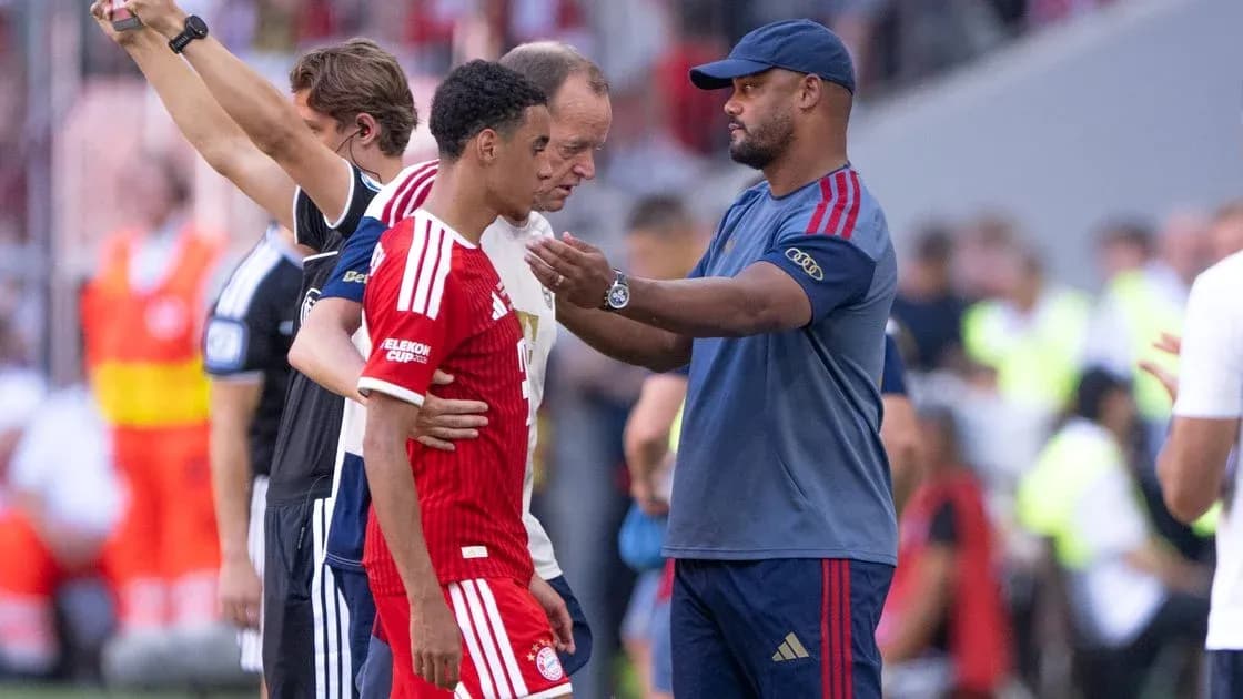 Coach talking to player during substitution on field Coach talking to player during substitution on field