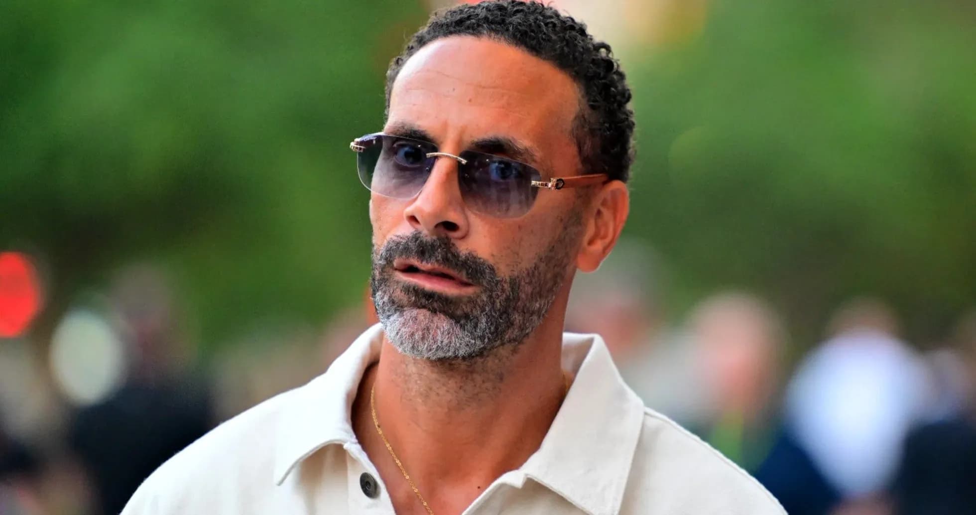 Man with sunglasses walking outdoors Man with sunglasses walking outdoors