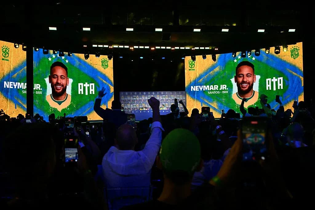 Neymar Jr. on stage at event with crowd Neymar Jr. on stage at event with crowd