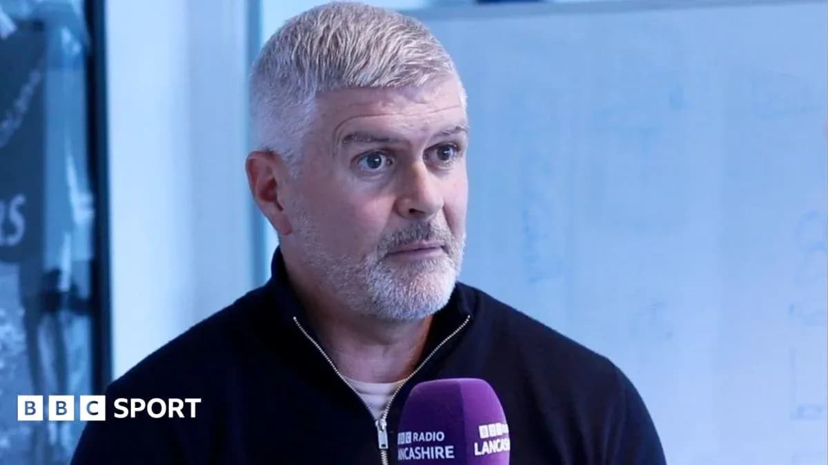 Man speaking into microphone during interview Man speaking into microphone during interview