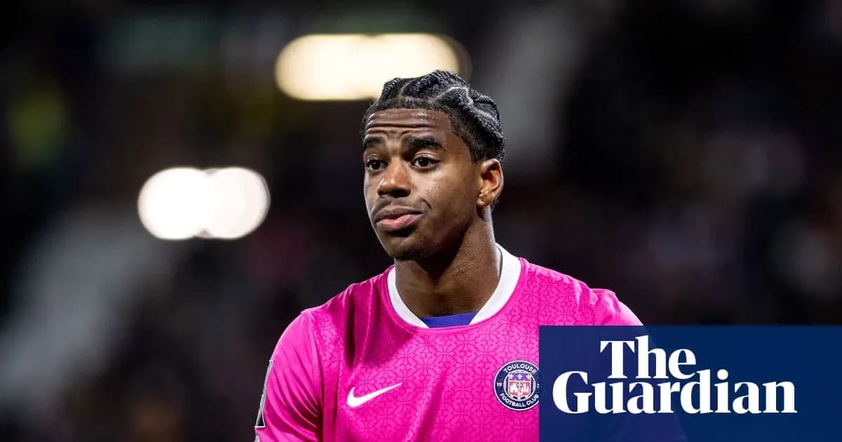 Goalkeeper wearing pink jersey during match warm-up Goalkeeper wearing pink jersey during match warm-up