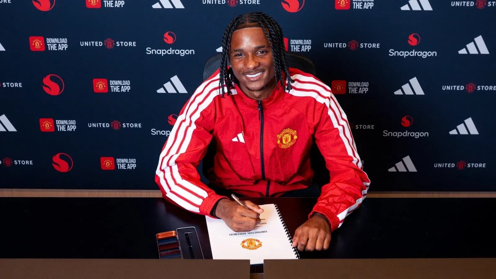 Player signing contract at Manchester United announcement Player signing contract at Manchester United announcement