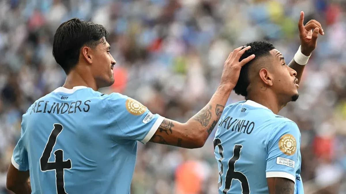 Two players celebrating on the field during match Two players celebrating on the field during match