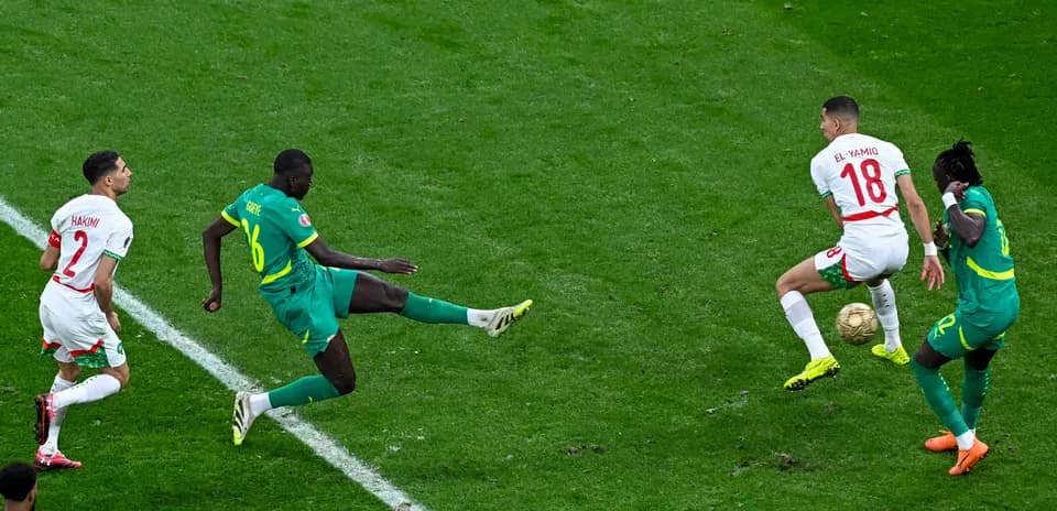 Players contesting the ball during a football match Players contesting the ball during a football match