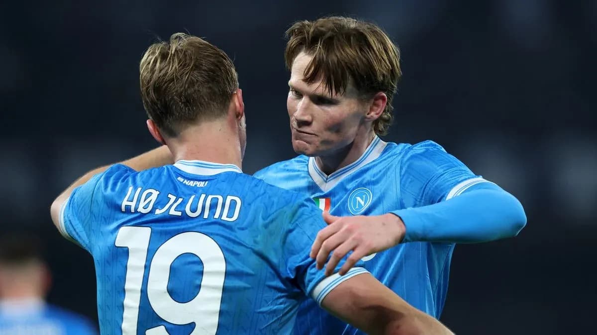 Two Napoli players celebrating together on the pitch Two Napoli players celebrating together on the pitch