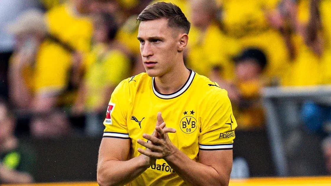 Player in yellow jersey applauding fans at stadium Player in yellow jersey applauding fans at stadium