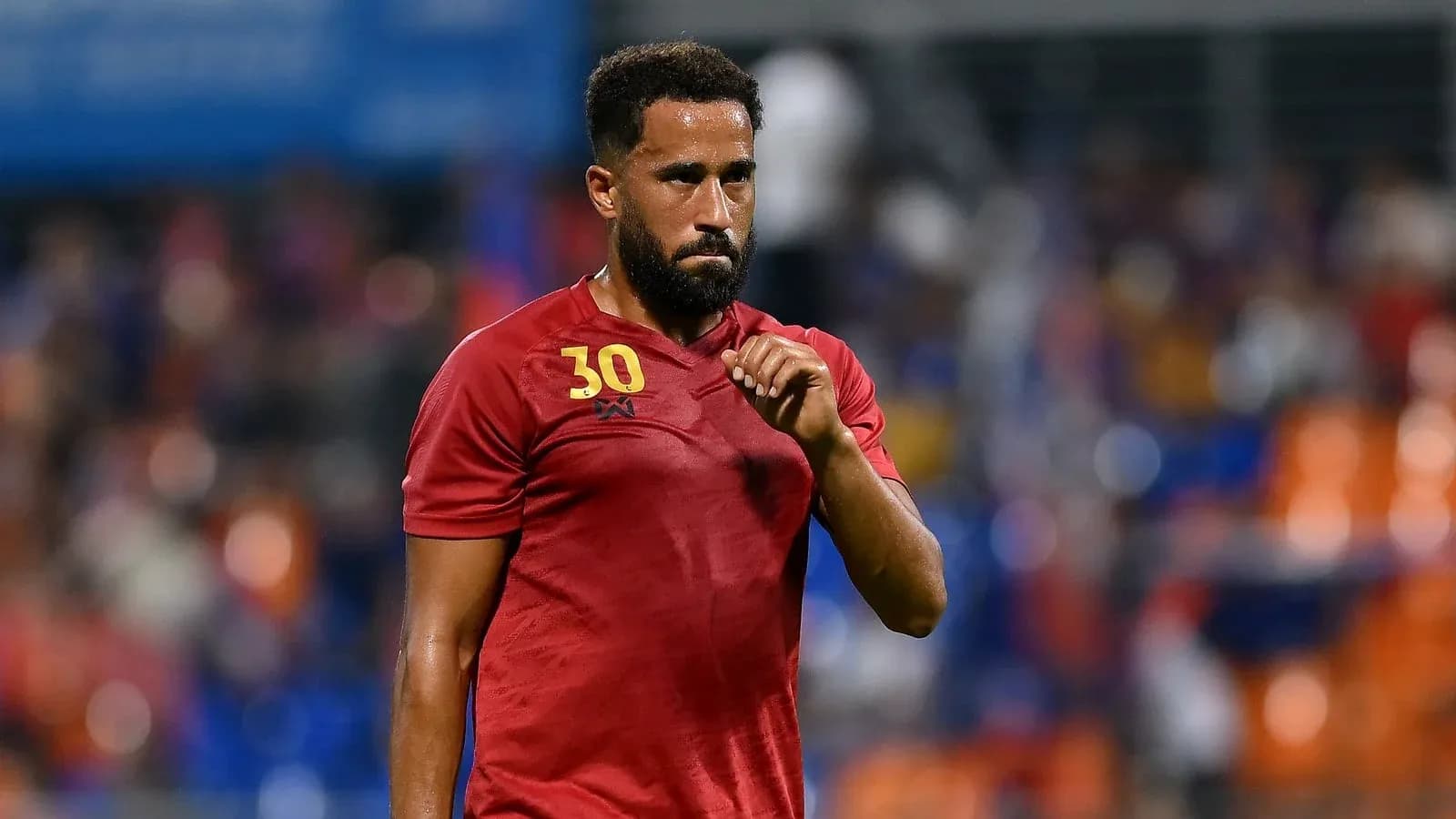 Player wearing red jersey during match action Player wearing red jersey during match action