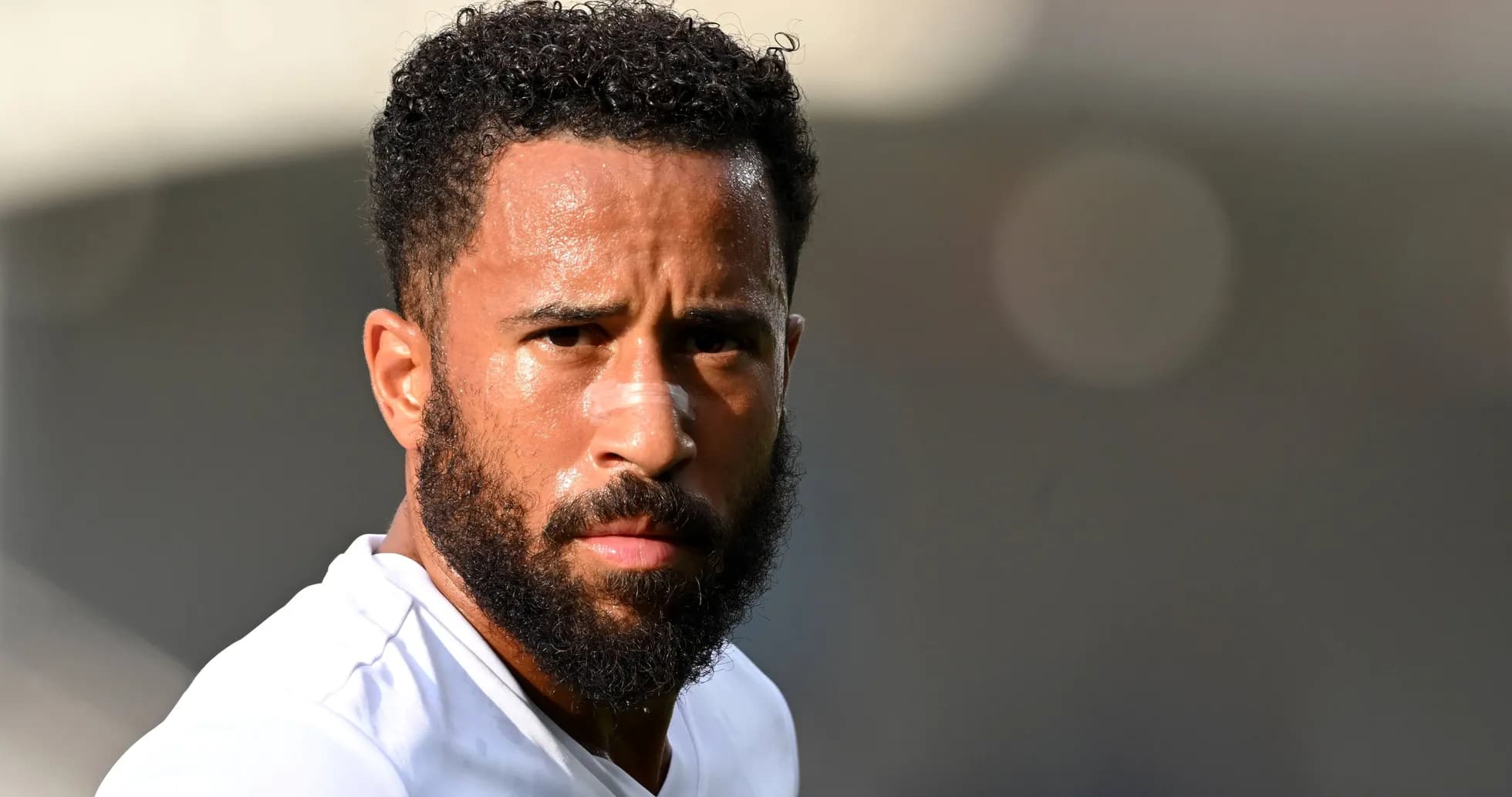 Player with beard looking directly at camera Player with beard looking directly at camera