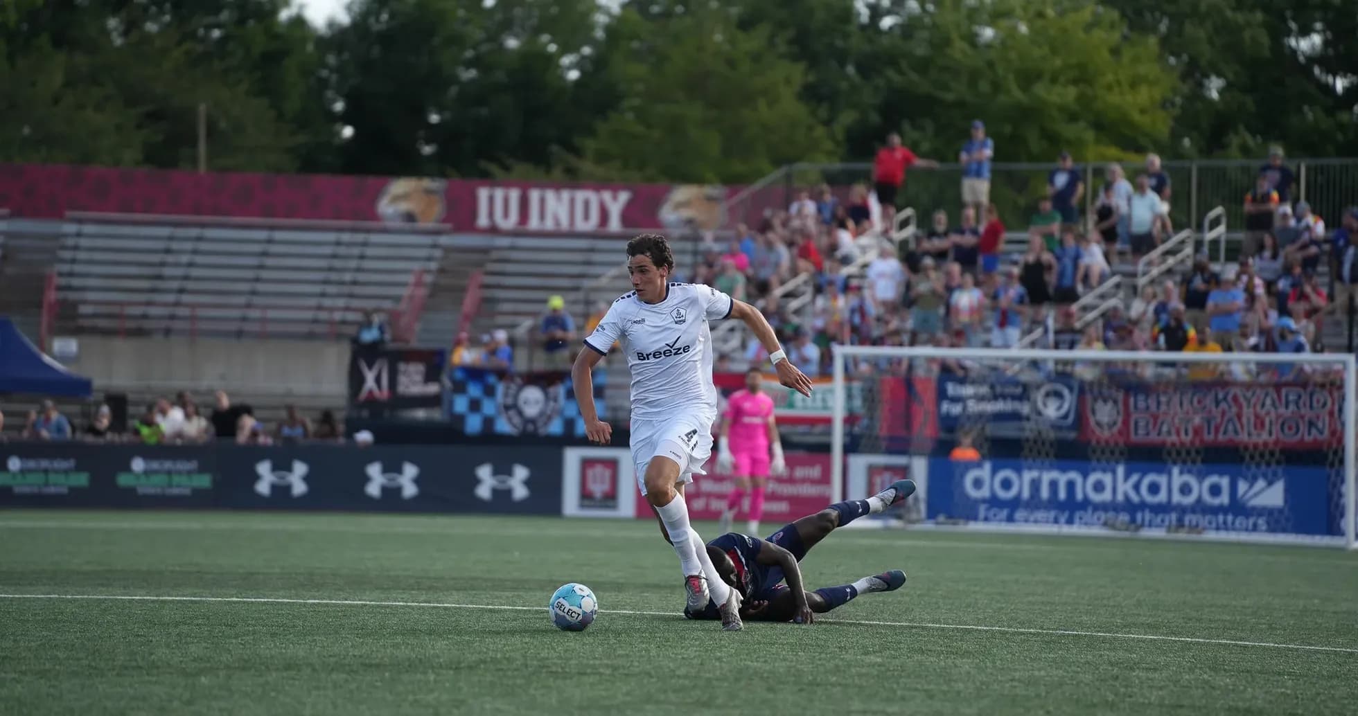 Player evading tackle during Indy Eleven match Player evading tackle during Indy Eleven match
