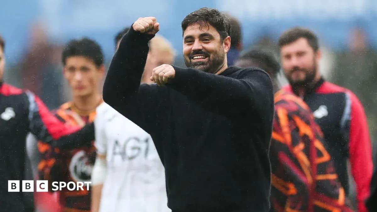 Coach celebrating with team during post-match moment Coach celebrating with team during post-match moment