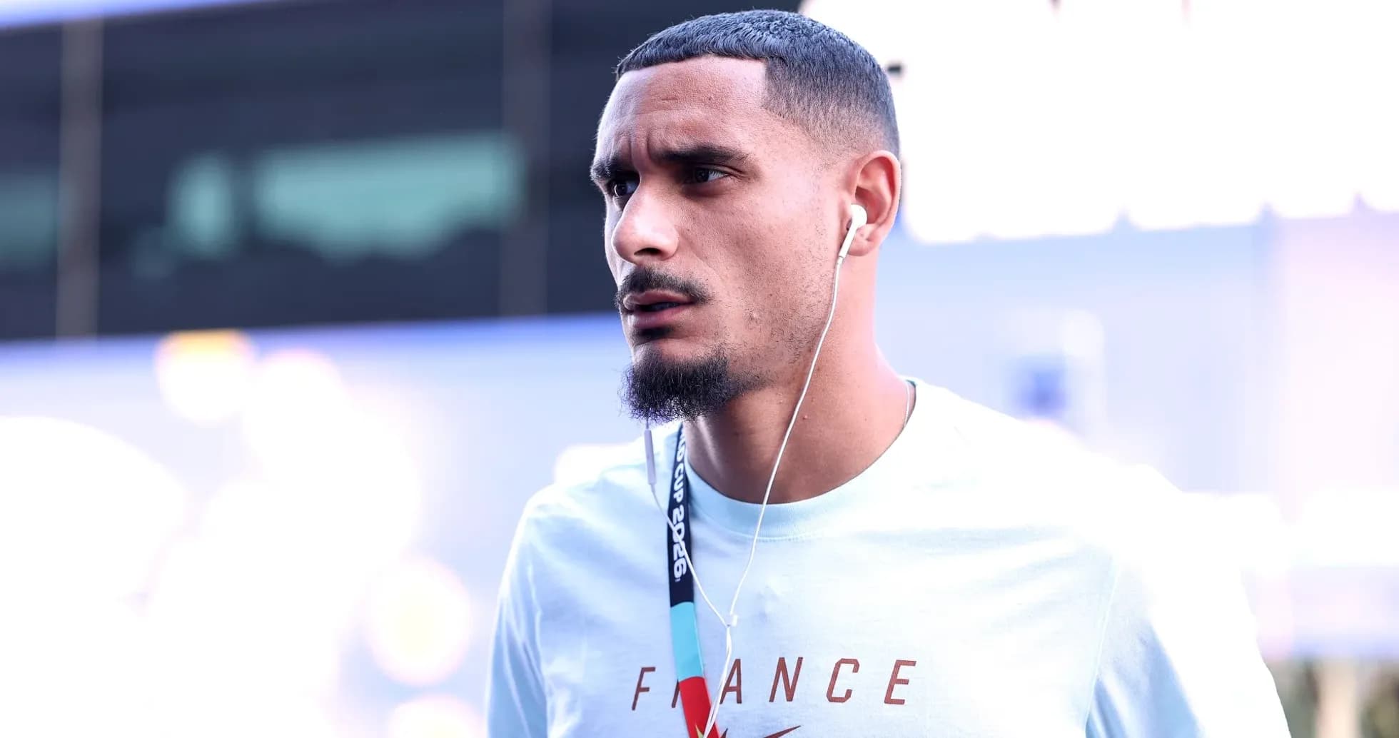Player wearing headphones arriving at venue Player wearing headphones arriving at venue