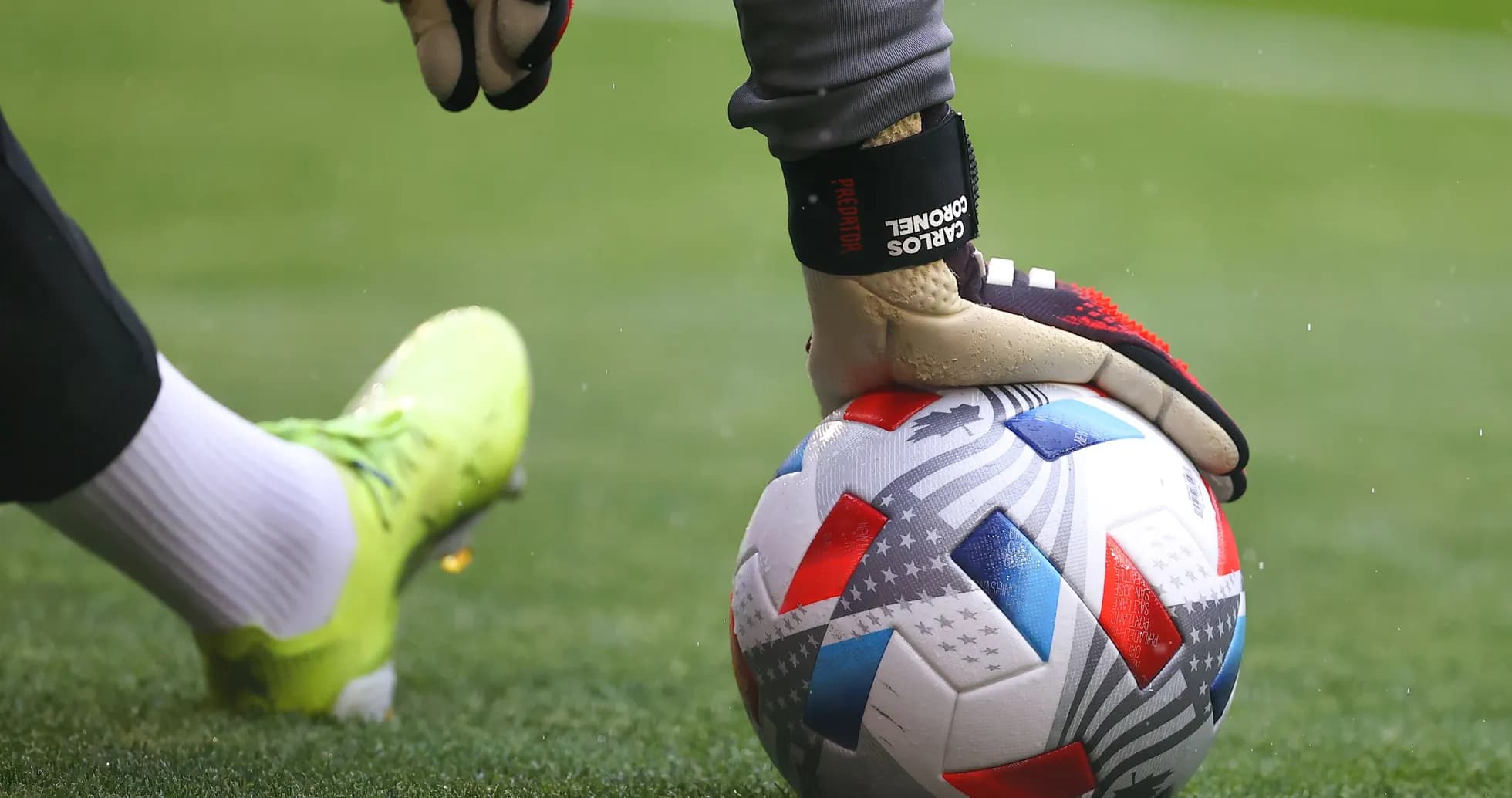 Goalkeeper placing ball on the pitch before kick Goalkeeper placing ball on the pitch before kick