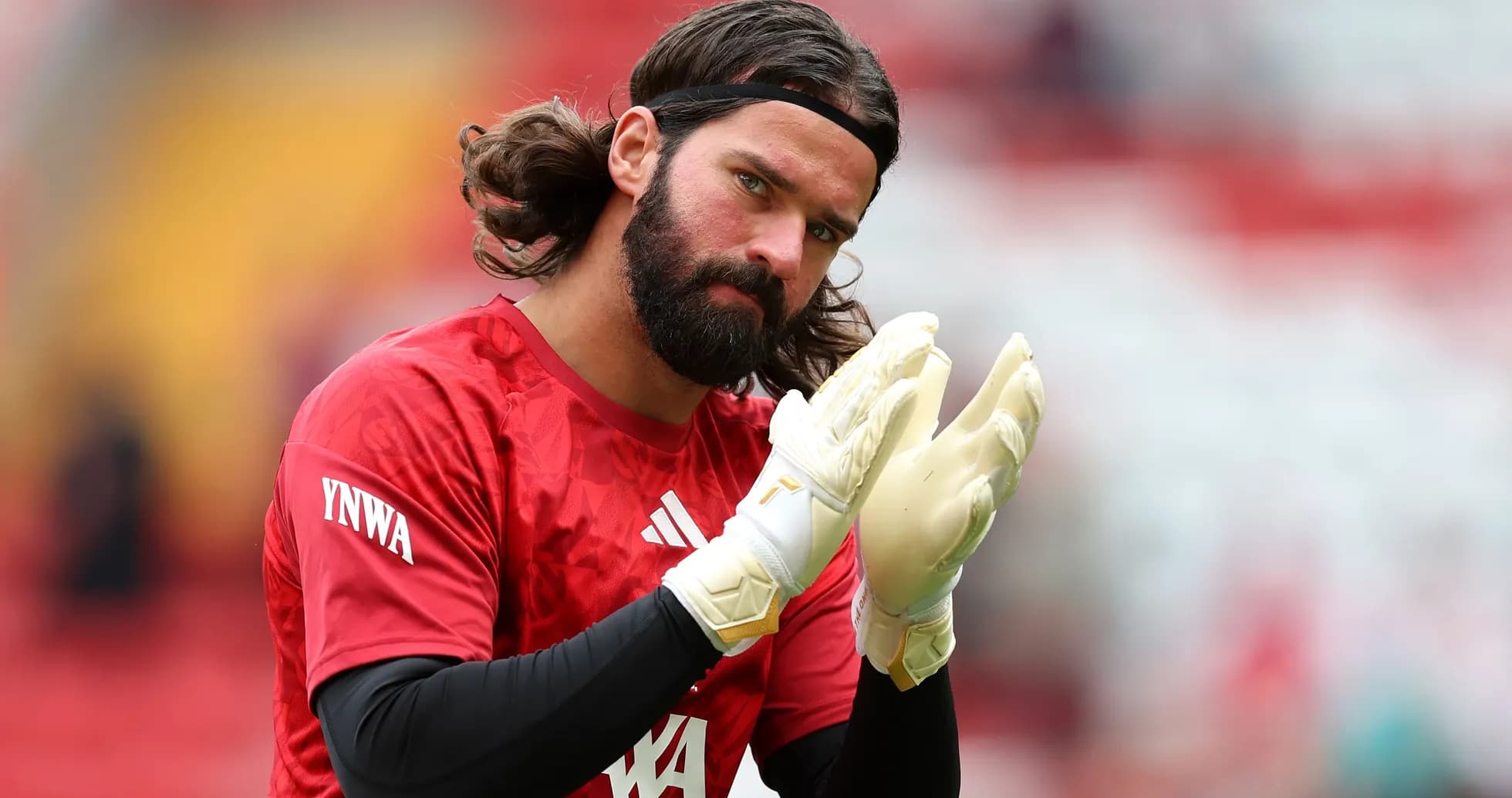 Goalkeeper clapping with gloves during warm-up Goalkeeper clapping with gloves during warm-up