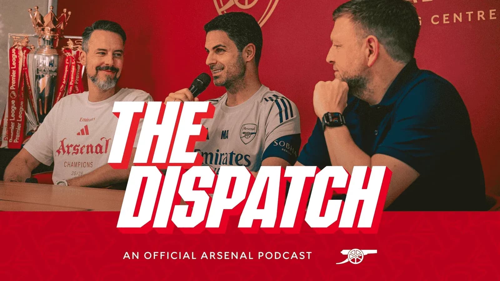 Podcast hosts discussing Arsenal at press table Podcast hosts discussing Arsenal at press table