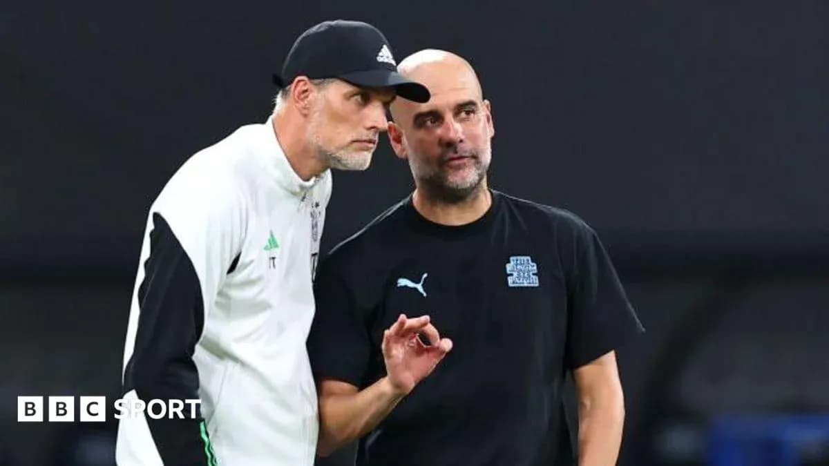 Two football managers discussing strategy on the pitch Two football managers discussing strategy on the pitch