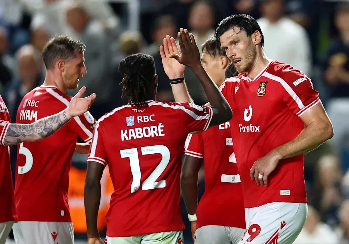 Players celebrating a goal during a match Players celebrating a goal during a match
