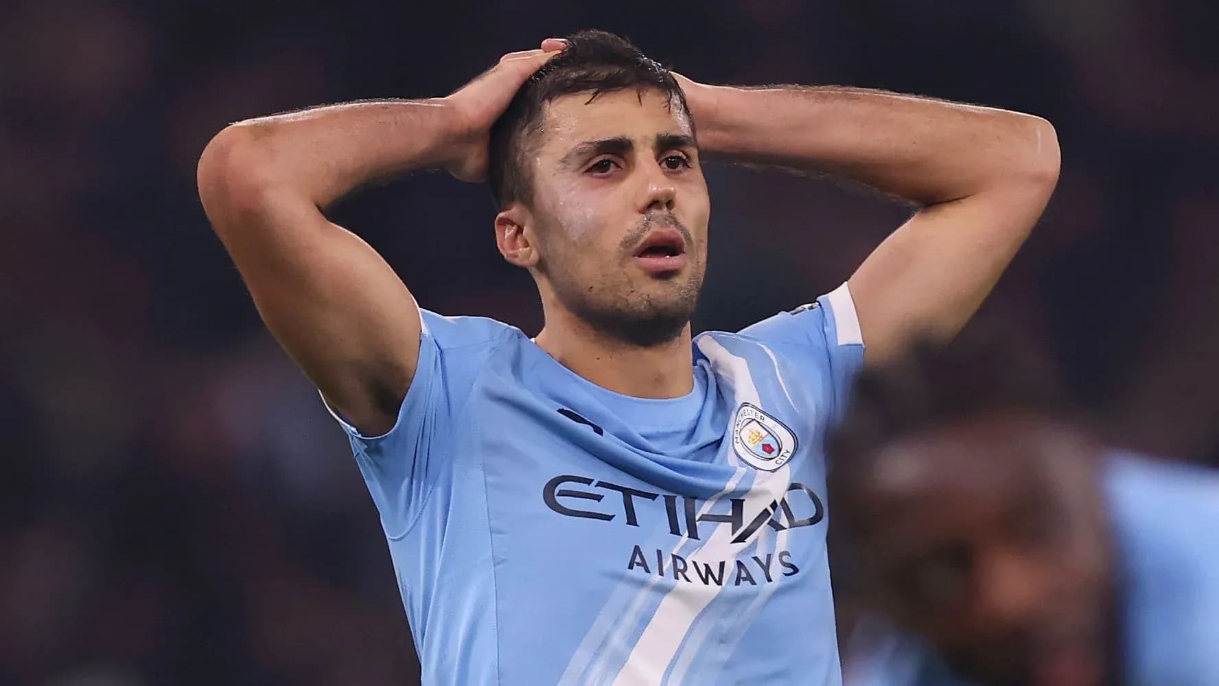 Player holding head in frustration during match Player holding head in frustration during match