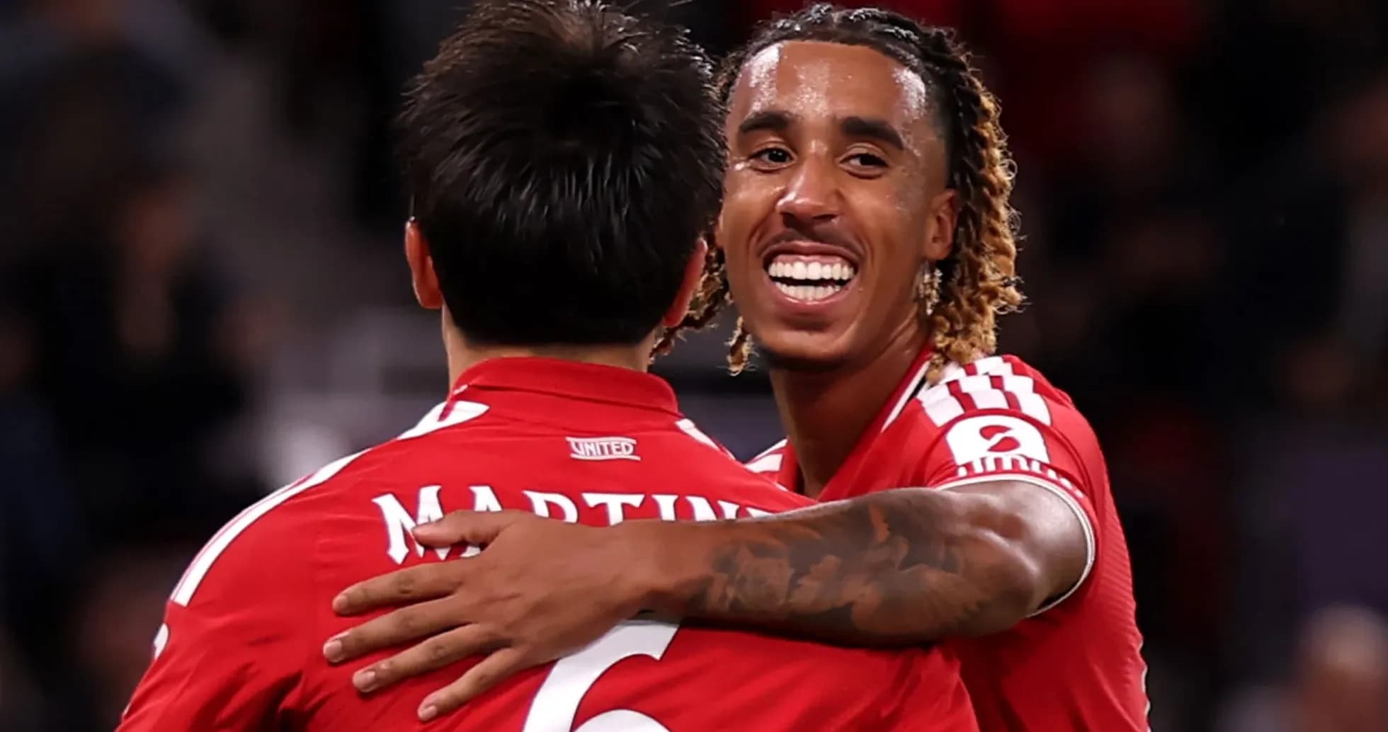 Two players celebrating together on the field Two players celebrating together on the field