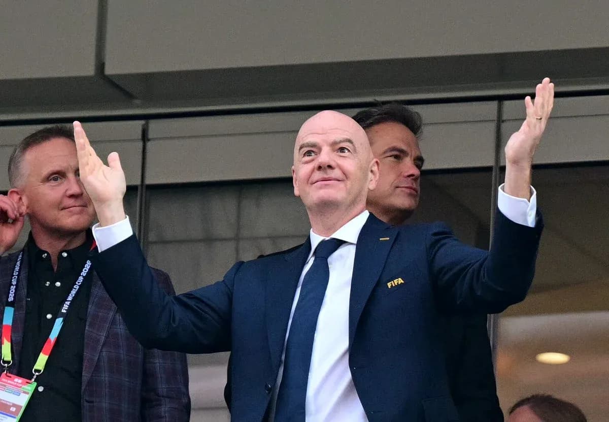 FIFA president gesturing during event with officials FIFA president gesturing during event with officials