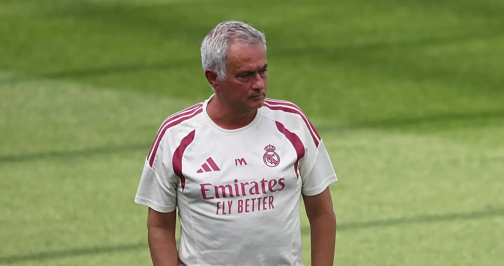 Coach walking on training pitch during session Coach walking on training pitch during session