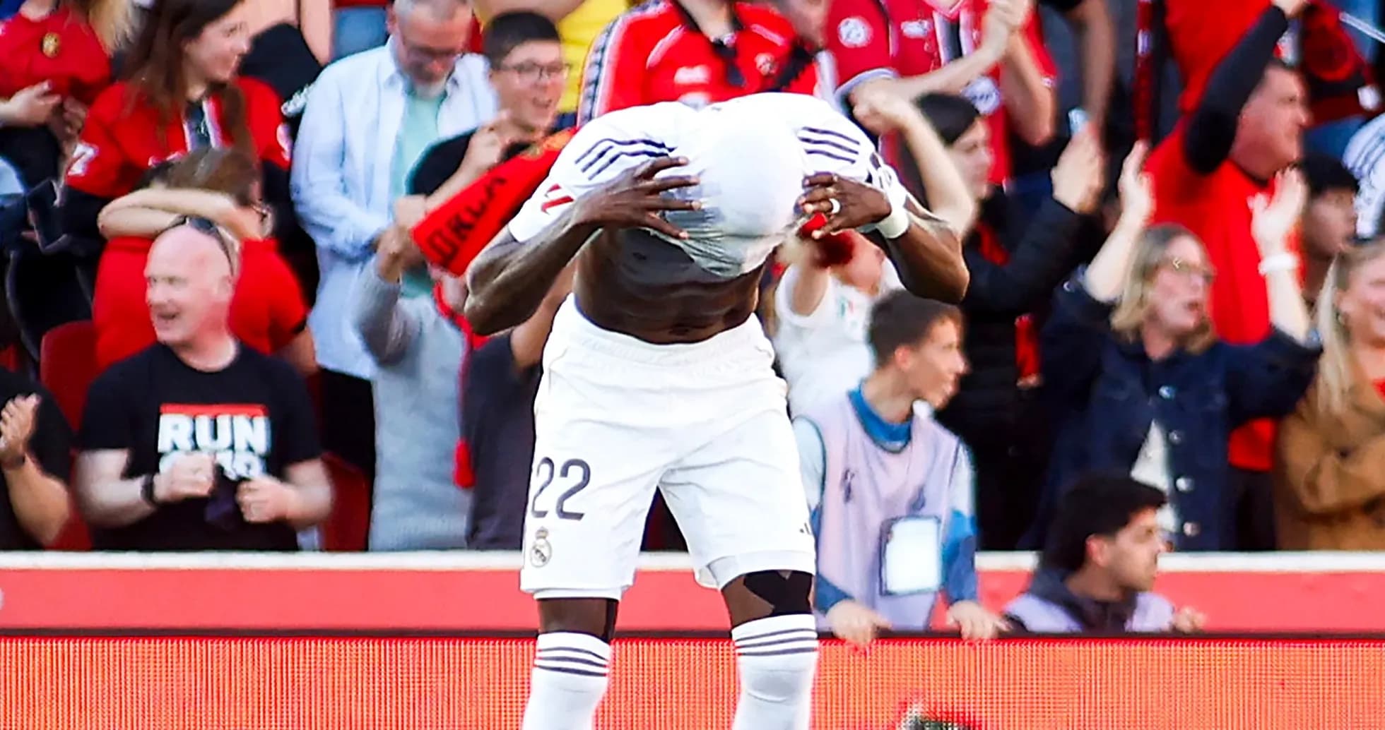 Player celebrating with fans after scoring a goal Player celebrating with fans after scoring a goal