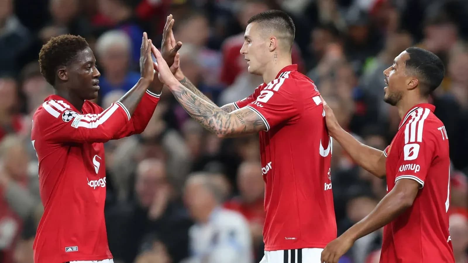 Three players celebrating a goal during match Three players celebrating a goal during match