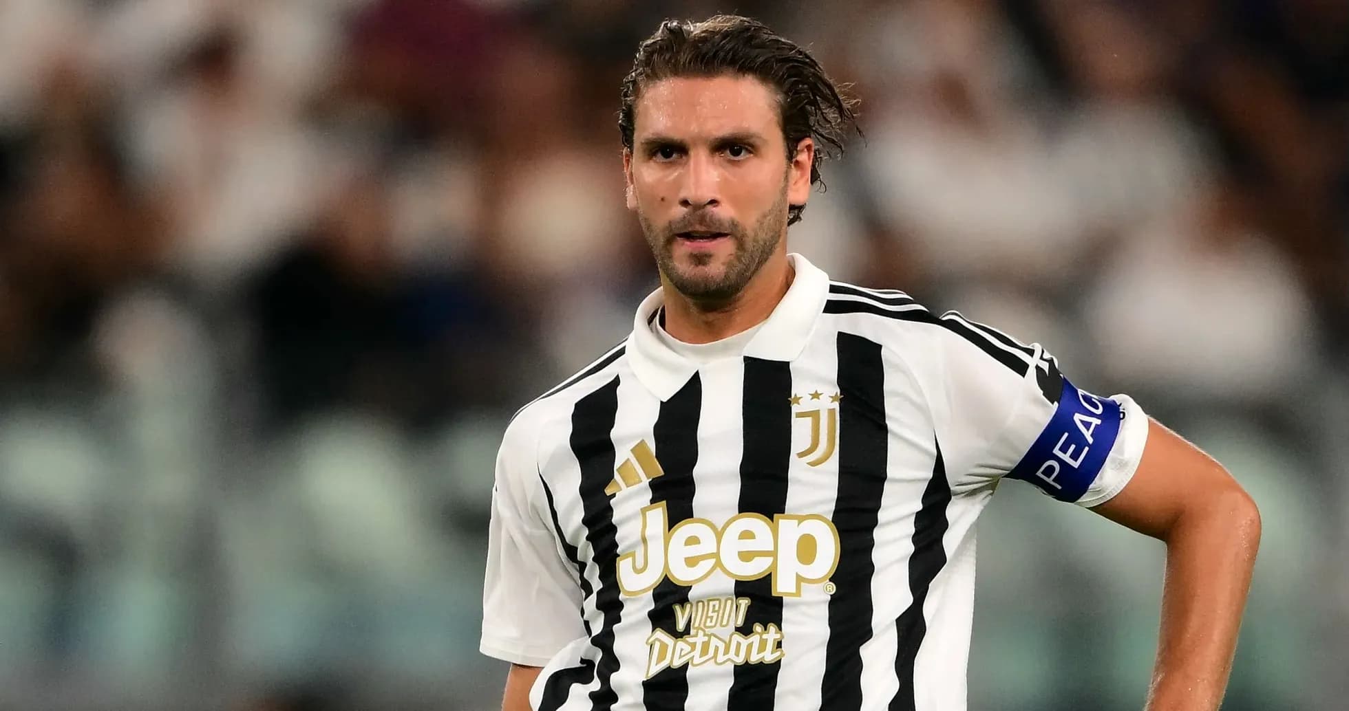 Juventus player in striped jersey during match Juventus player in striped jersey during match