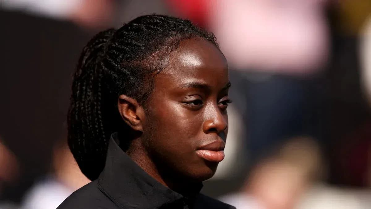Athlete with braided hair on the sidelines Athlete with braided hair on the sidelines