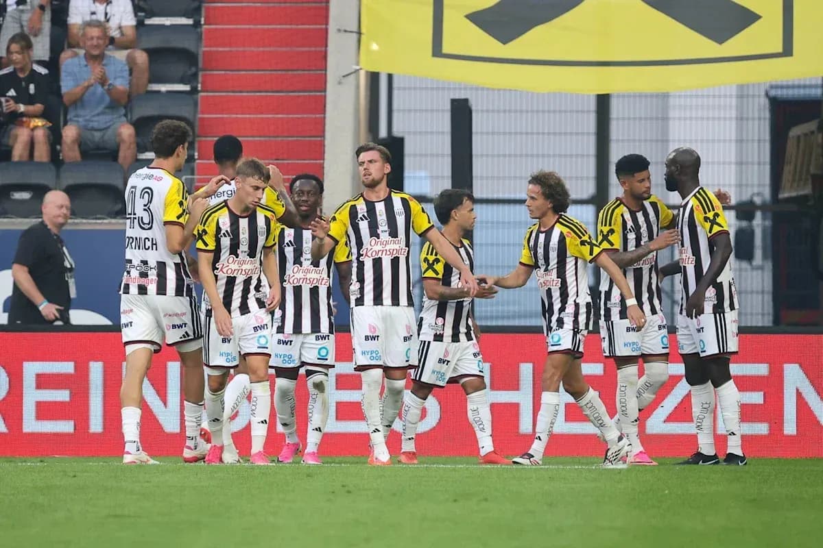 Team celebrating a goal on the field Team celebrating a goal on the field