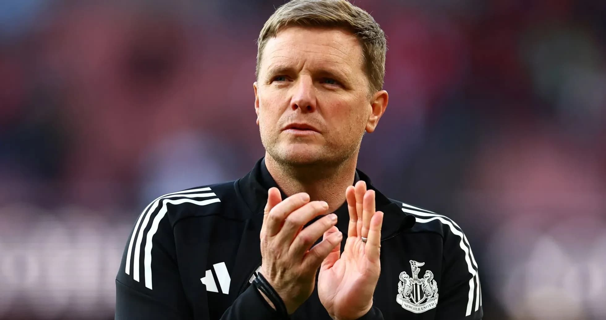 Manager clapping during match at stadium Manager clapping during match at stadium