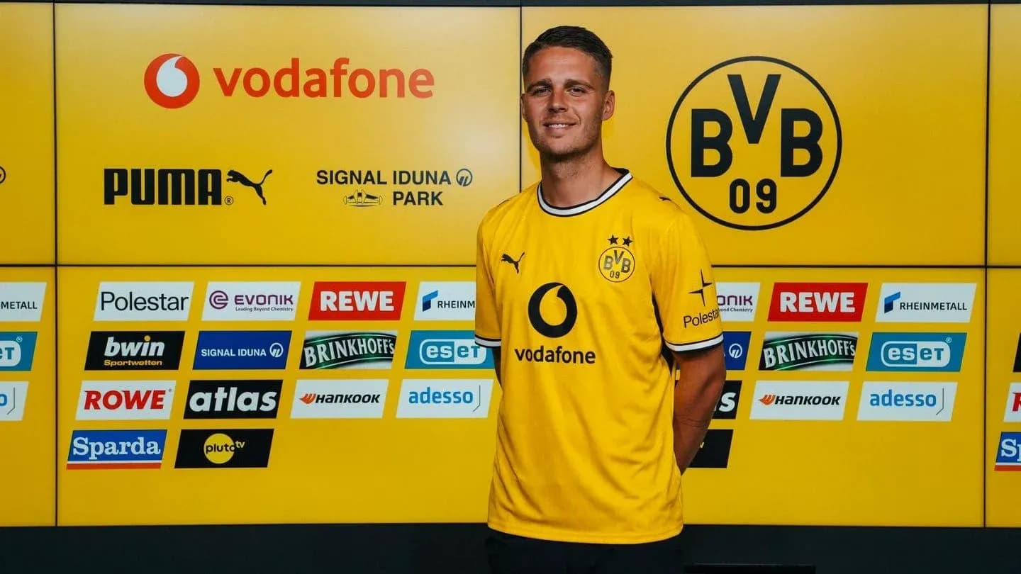 Player in Borussia Dortmund jersey at press conference Player in Borussia Dortmund jersey at press conference