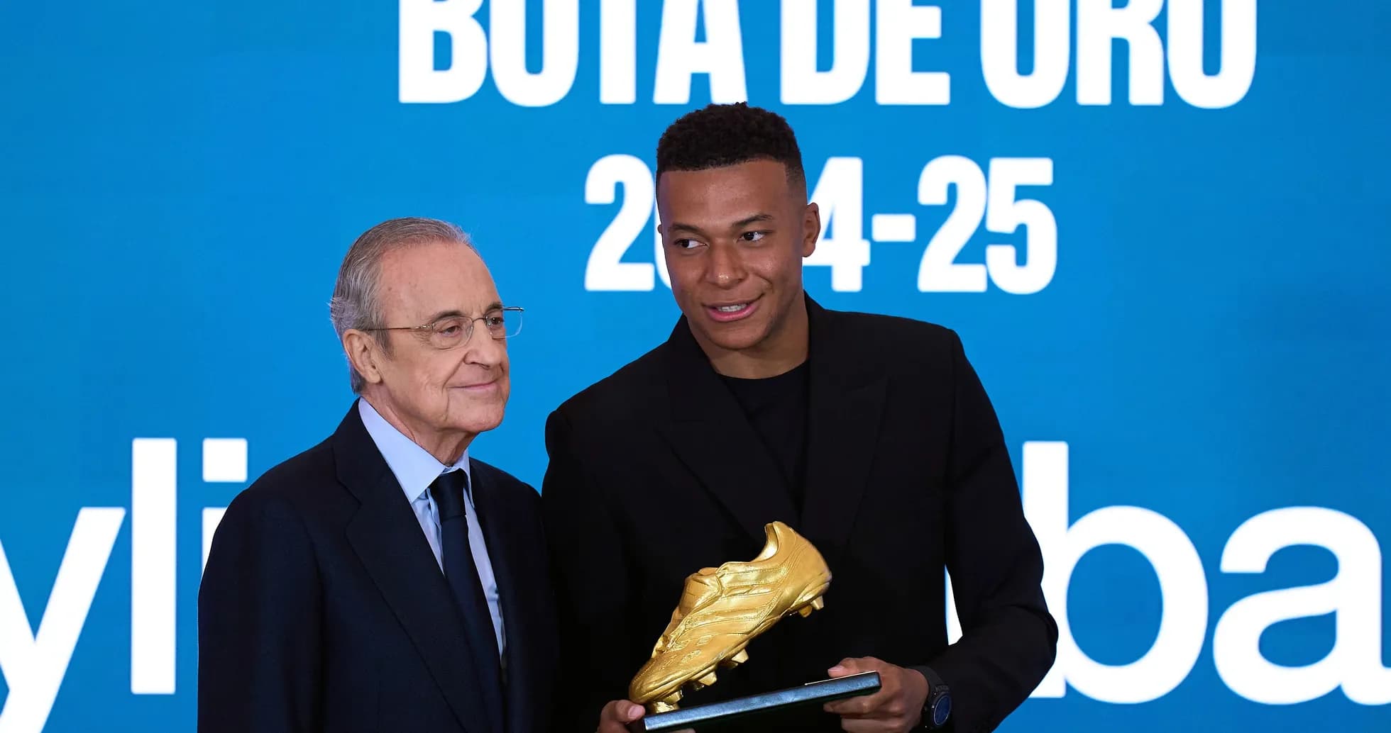Kylian Mbappé receiving Golden Boot award from president Kylian Mbappé receiving Golden Boot award from president