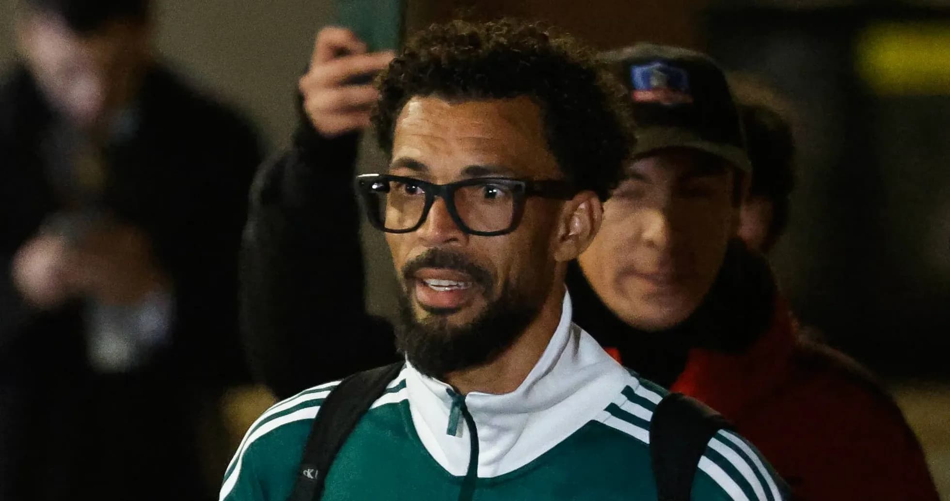 Player in green jacket arriving at event Player in green jacket arriving at event
