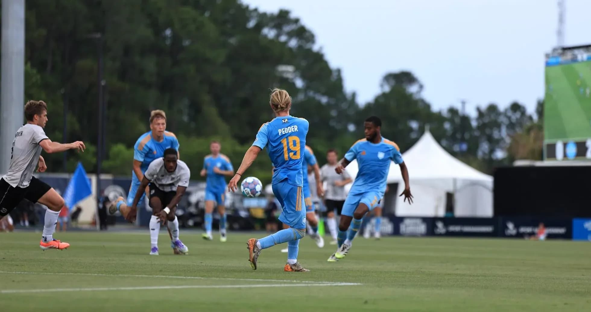 Player passing the ball during JAX match Player passing the ball during JAX match
