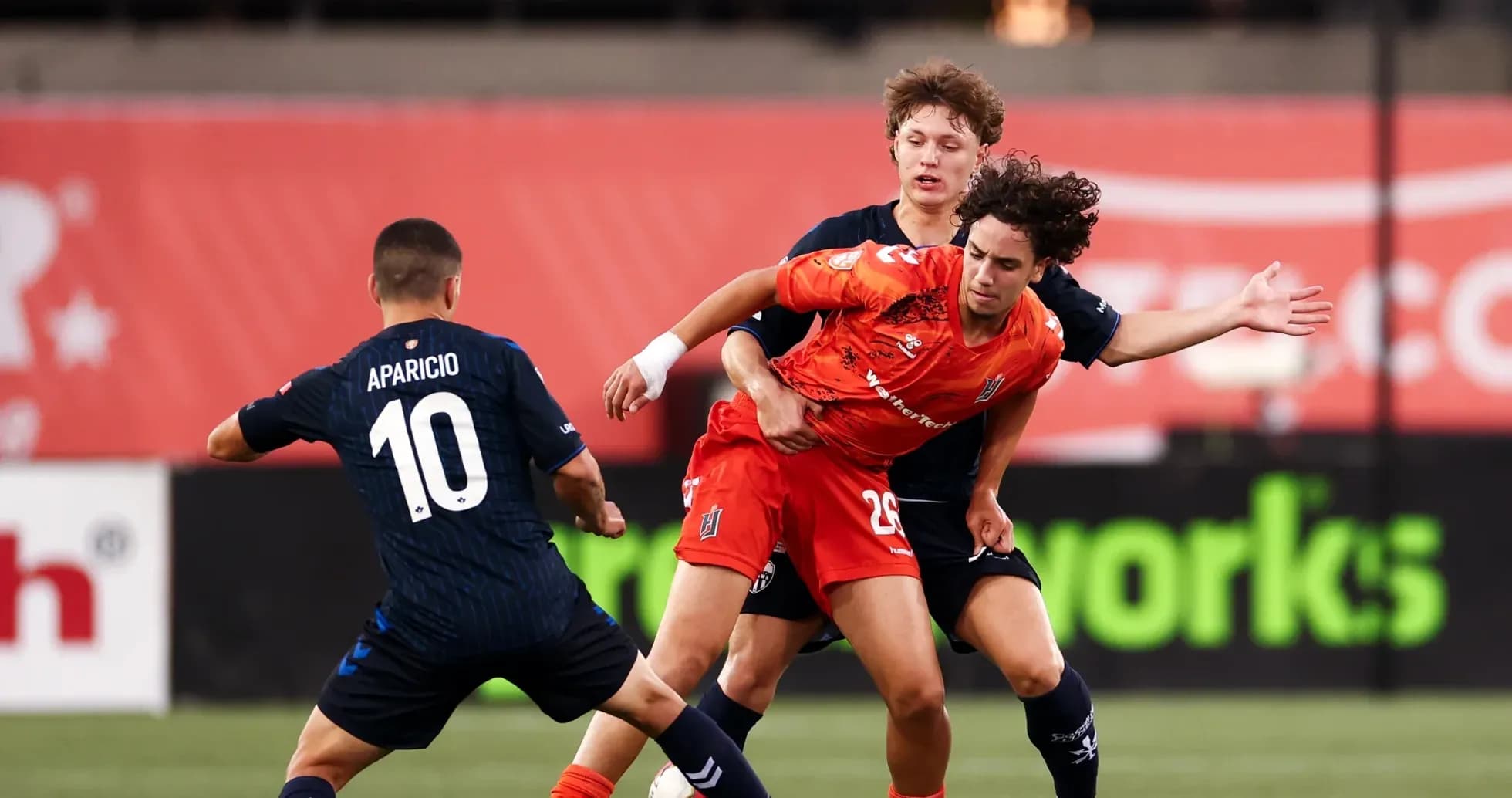 Players competing for the ball during match Players competing for the ball during match