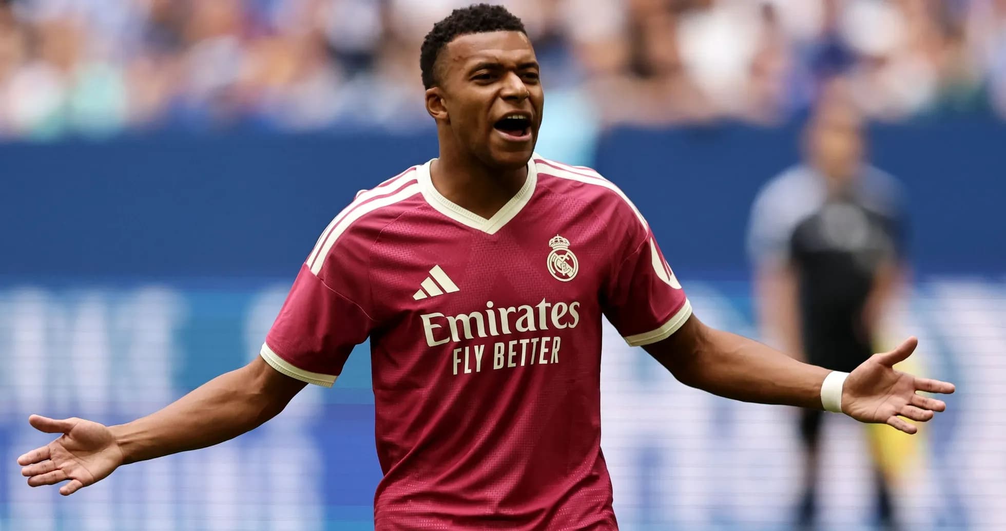 Player celebrating in pink Real Madrid jersey Player celebrating in pink Real Madrid jersey